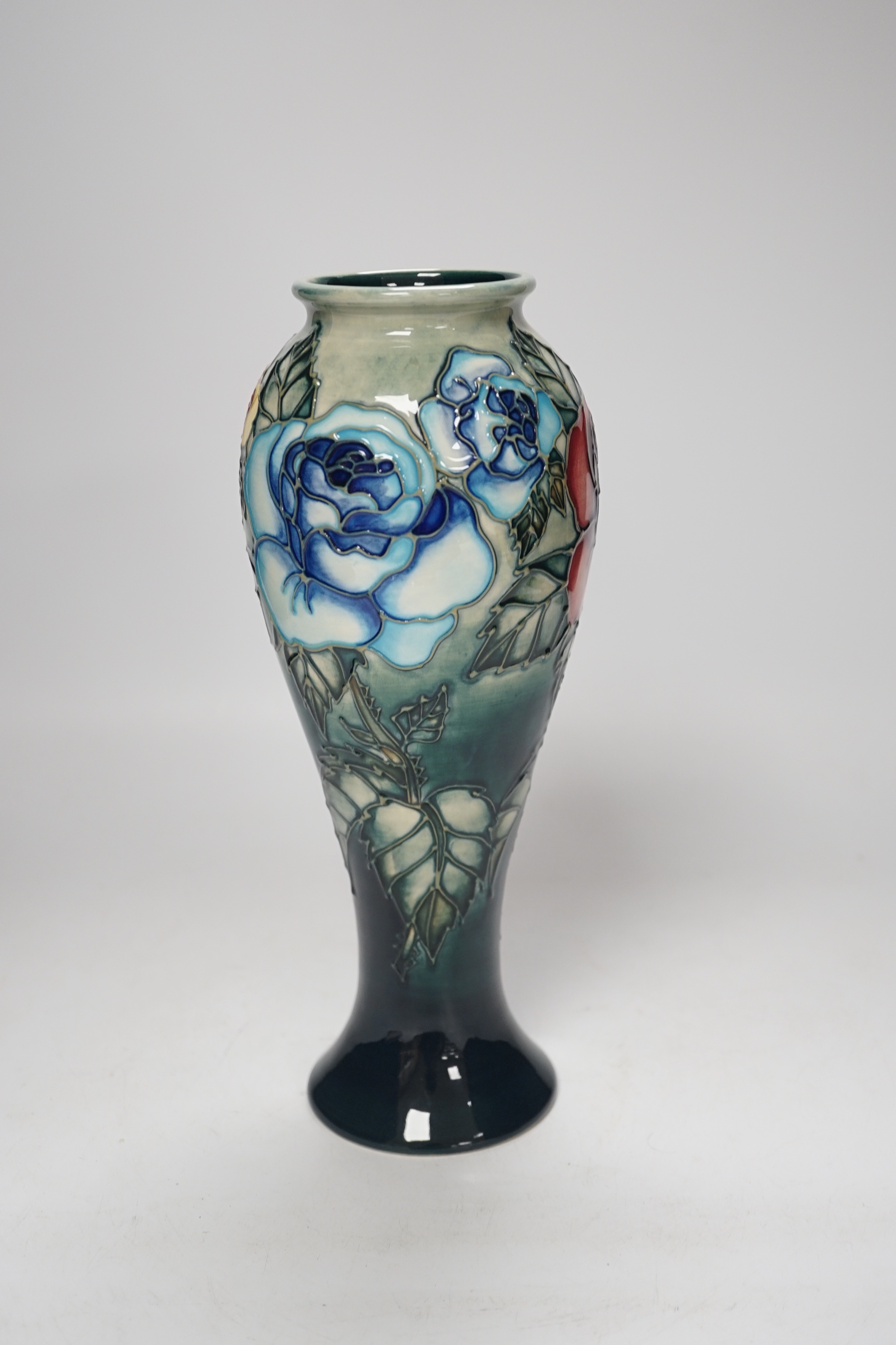 A Moorcroft ‘Rose & Bud’ vase by Sally Tuffin, limited edition 423/500, 27cm high